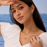 Woman wearing jewelry with a scenic background