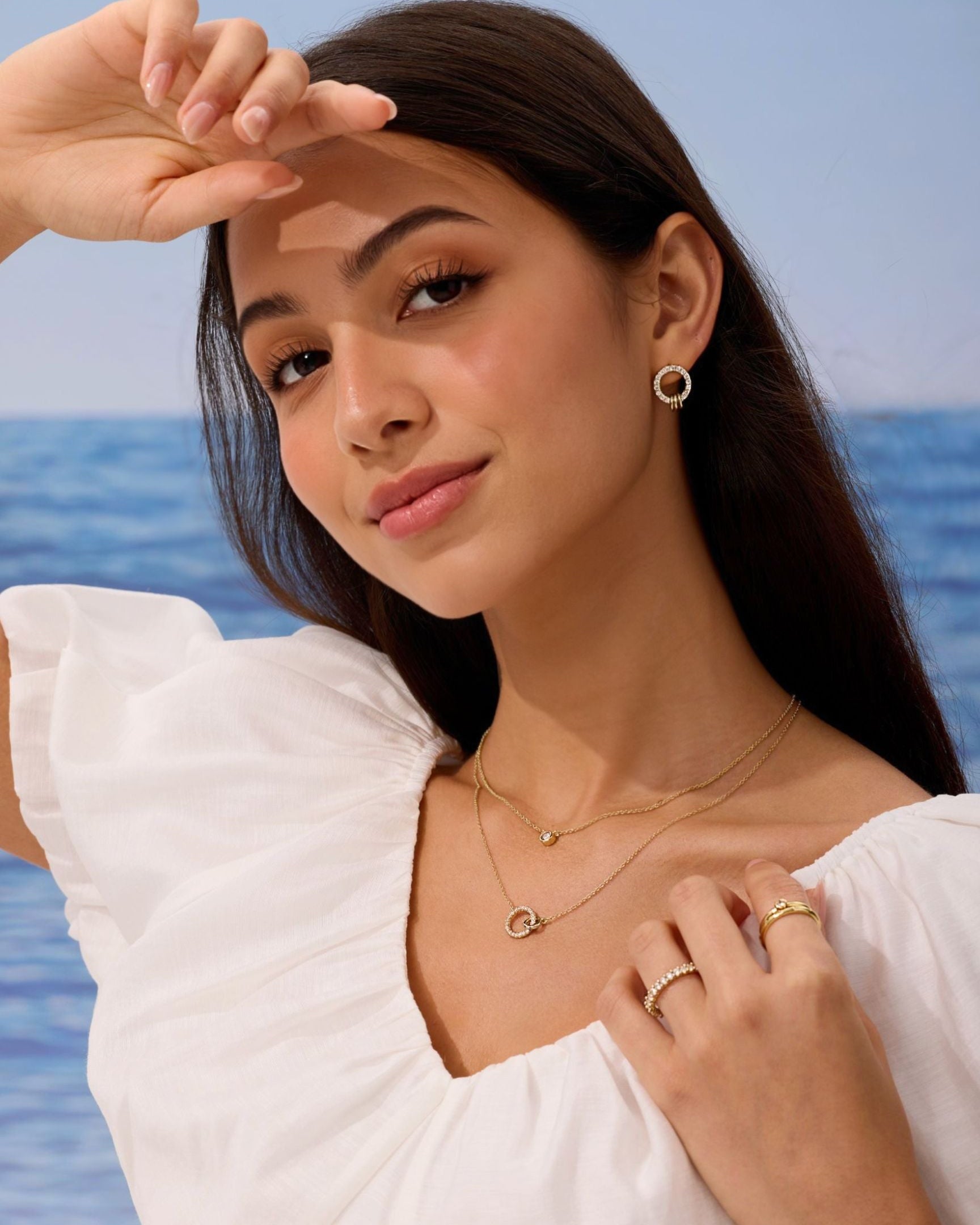 Woman wearing jewelry with a scenic background